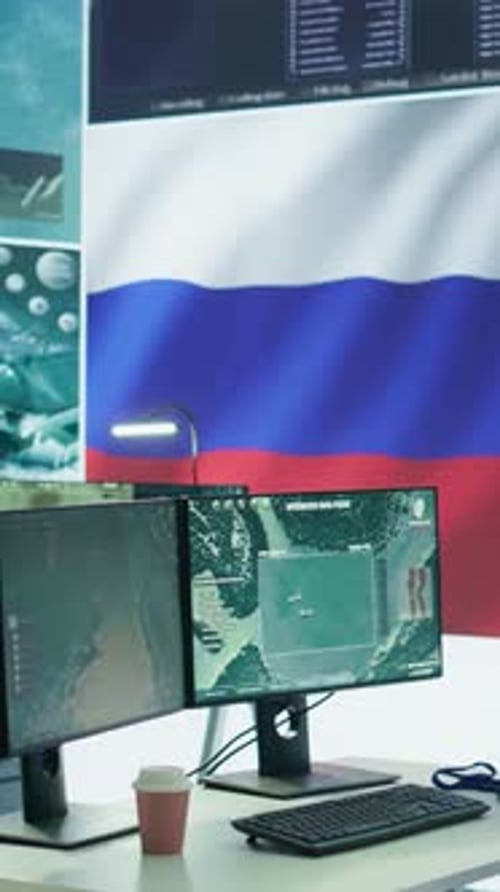 Technology Office Showing Dual Computer Monitors With Map Data