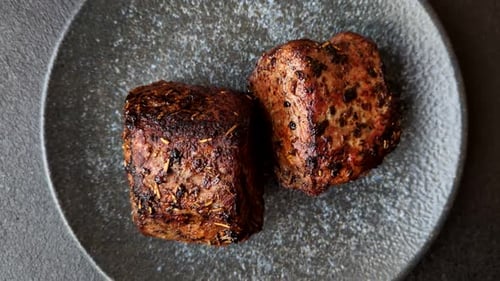 Two Seasoned Meat Portions Served on Plate