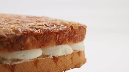 Delicious Cake with Almond Topping and Cream Filling