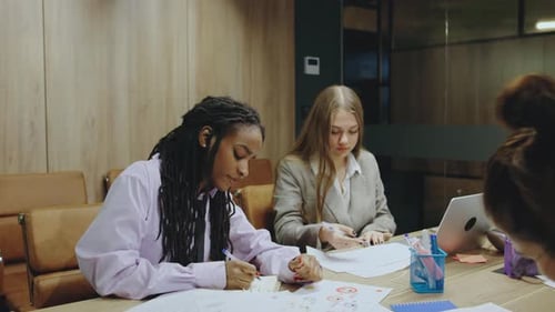 In a Dynamic Office Dedicated Professionals Engage in Teamwork Boosting Productivity and Fostering