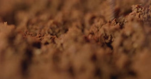 Powder Granules Being Doused with Liquid