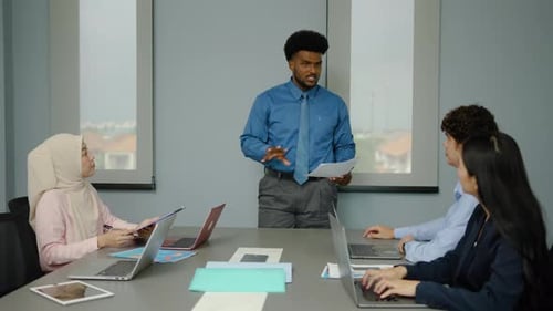 Business Meeting Presentation in Modern Office