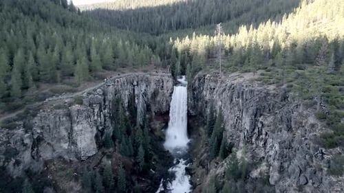 Drone View of a Beautiful Waterfall That Continues Into the River