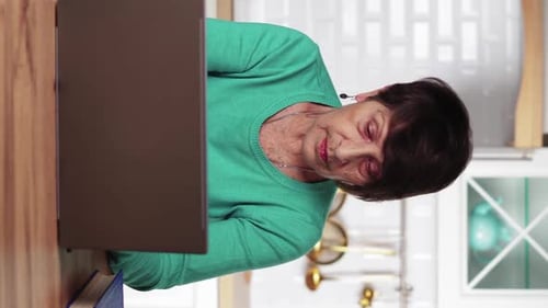 Senior Woman Using Laptop at Home