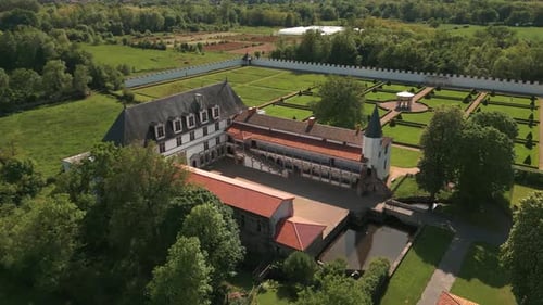 aerial shot around batie d'urfe castle in Saint Etienne le Molard in Loire departement on a suny day