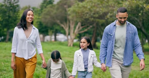 Walking, holding hands and happy family in park, bonding in nature with freedom and support