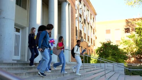 Group of Diverse University Students Leaving Building