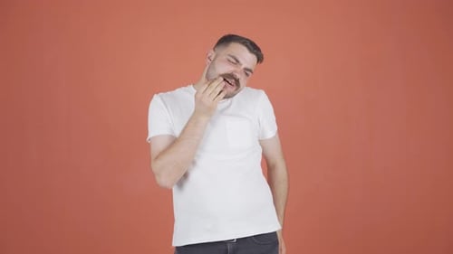 Man with toothache.