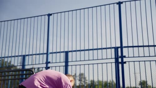 Basketball Player in Slow Motion Perfecting Dribbling on Outdoor Court