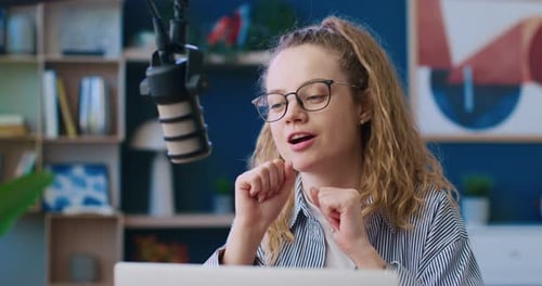 Close Up View of Professional Radio Host Leading Morning Program Female Wearing Glasses and Talking