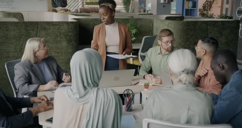 Diverse Team Collaborating in Modern Office Meeting