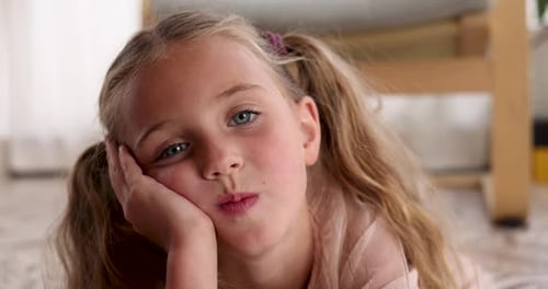 Young Blonde Girl Lying Down Close Up Indoors