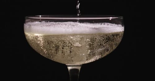 Champagne Pouring Into Glass Sparkling Wine with Golden Bubbles Elegant Drink for Celebration Luxury