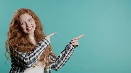 Smiling Woman Points Sideways in a Simple Portrait