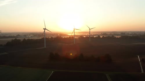 Wind Turbines in Rural Landscape at Sunrise
