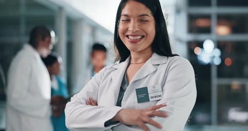 Cheerful Young Medical Professional Smiles in Hospital