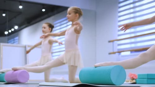 young ballerinas in a stretching lesson