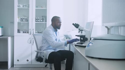 Scientists Performing Research in a Modern Bright Lab