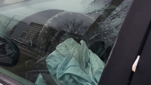 Damaged Airbag Inside an Old Car Covered with Fungi