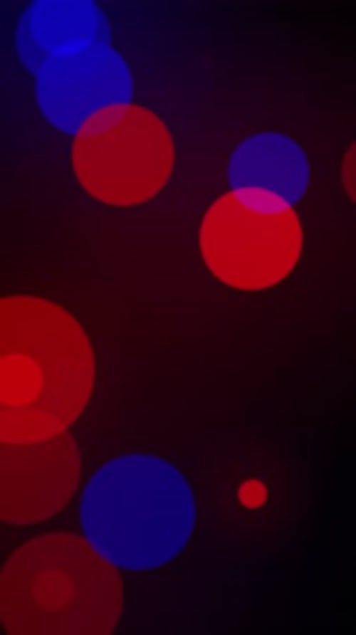 Blurred red and blue particles background.