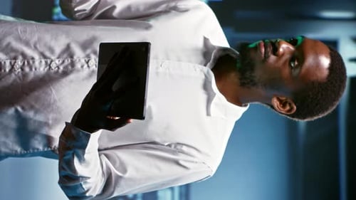 Vertical Video Technician Doing Checkup in Server Room