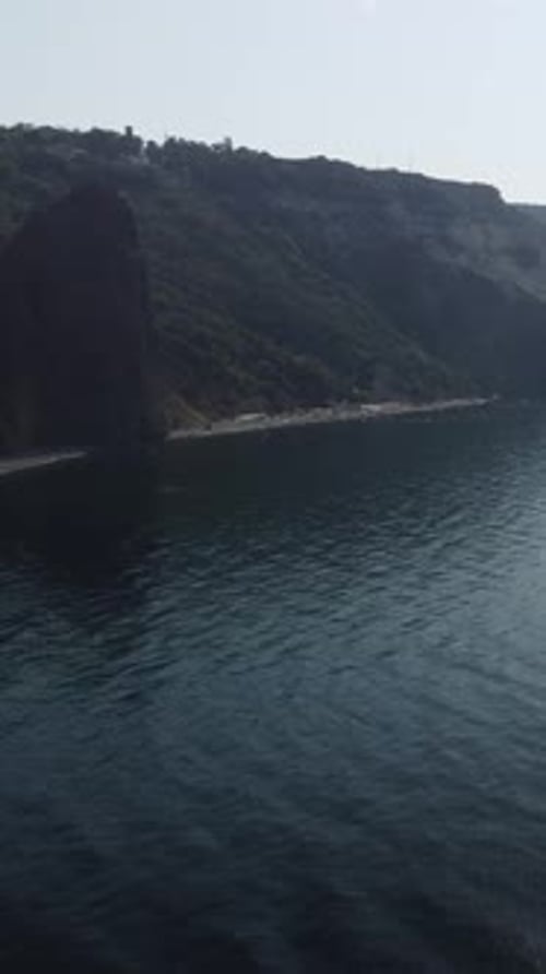 Aerial Vertical View on Calm Azure Sea and Volcanic Rocky Shores Small Waves on Water Surface Nature