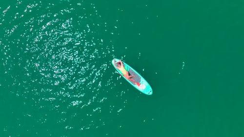 Aerial View Journey on Paddleboards Through the Green Canyon People Relax and Have Fun in the Summer