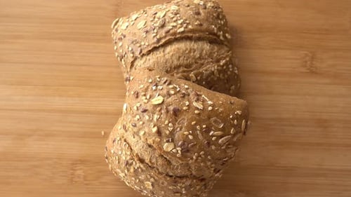Rustic Seeded Bread Rolls on Wooden Surface