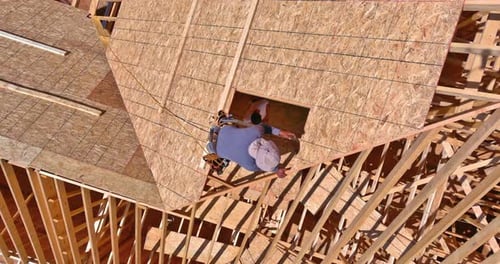 Construction Worker Building a House Aerial View
