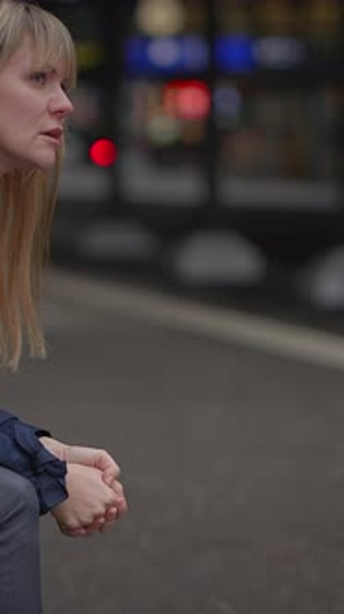 Woman Looking Distraught in Urban Setting
