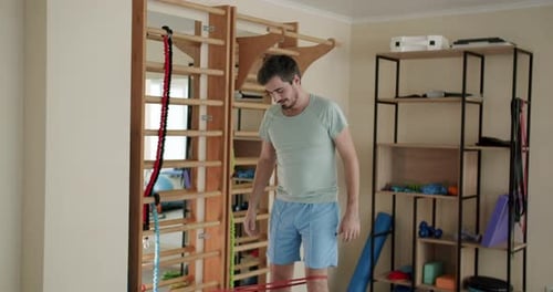 A Man Do Exercises with Elastic Band Physiotherapy Program Healthcare Concept