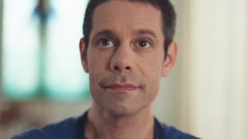 Man Puts On Protective Glasses Indoors