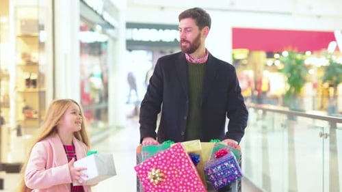 Portrait Father with Daughter Bought Christmas Present Boxes Gifts in Cart on Shopping Center Smile