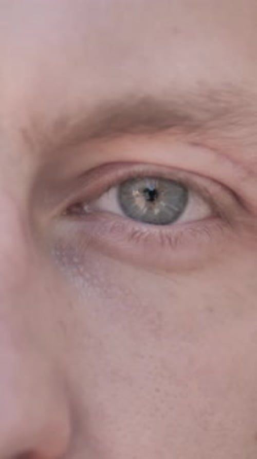 Blinking Eyes of Casual Young Man, Vertical Video