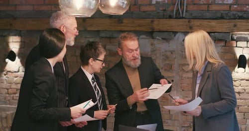 Business Team Discussing Charts in an Office