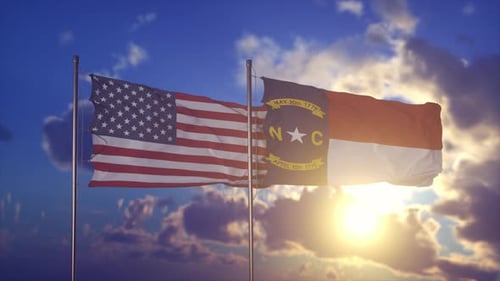 United States and North Carolina Flags Waving