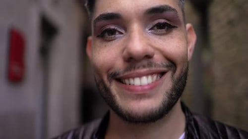 Happy gay transgender person looking at camera . LGBTQ nonbinary concept