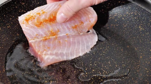 Grilled Salmon Fish in a Pan on a Flaming Grill