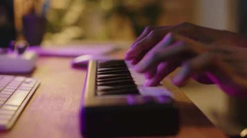 Close Up of Hands Playing Keyboard