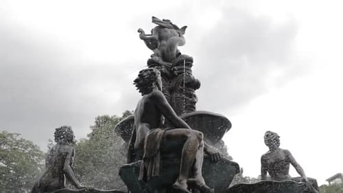 View of fountain with ornate statues in park in dominican republic.