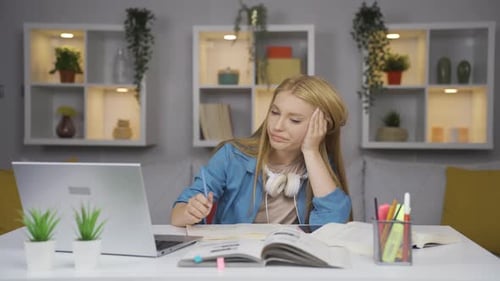 Tired Student Studying at Home