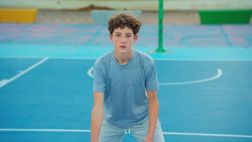 Slow Motion Street Basketball Boy Practicing Shooting a Basketball The Teenager Plays Basketball
