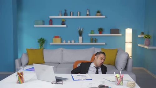 Home office worker man falling from chair.