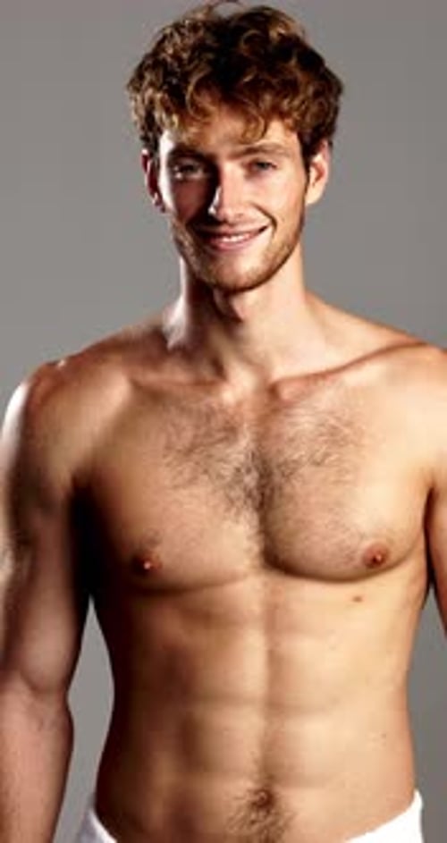 Happy, skincare and man with towel in studio for wellness, cleaning and hygiene routine