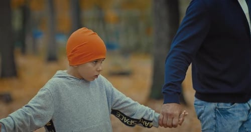 Family Walk in Park in Autumn Portrait of Cute Boy Holding Parents Hands Prores