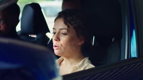 Woman Talks to Friends in Car on Sunny Day