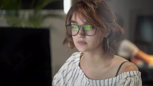 Woman Working at Computer in Office