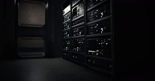 High Tech Server Room with Illuminated Racks During Nighttime Operation