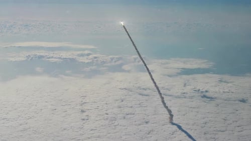 Rocket Launch Through Clouds into Outer Space