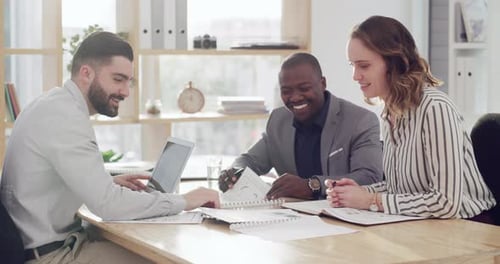 4k video footage of a group of businesspeople going through paperwork together in an office